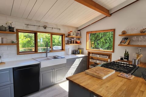 From the amateur chef to the accomplished, this kitchen is beautifully designed, well equipped with an open easy feel.