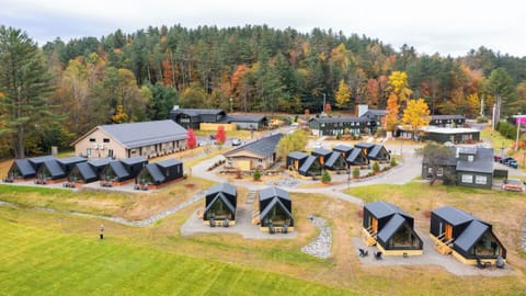 Explore the expansive retreat layout nestled among autumn woods.