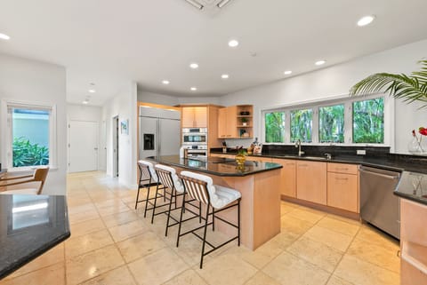 Modern kitchen with island seating, perfect for cooking and hanging out together.