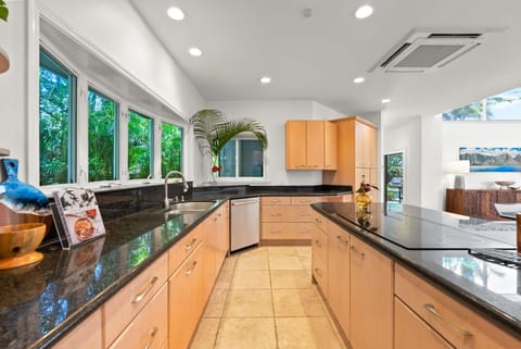 Bright corner kitchen with plenty of counter space and natural light.