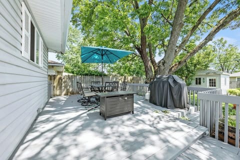 Relax in our private backyard featuring propane BBQ grill, outdoor seating, propane fire pit, string lights and wood fire pit (wood not provided)