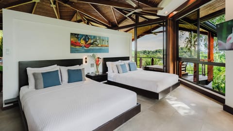 Bedroom with two queen beds and ocean and jungle views