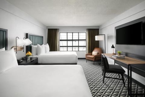 Settle in with bright natural light and crisp hotel bedding.