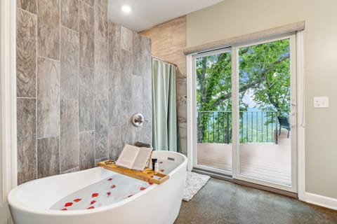Relax in a spa-like master bathroom while enjoying a view of Lookout Valley