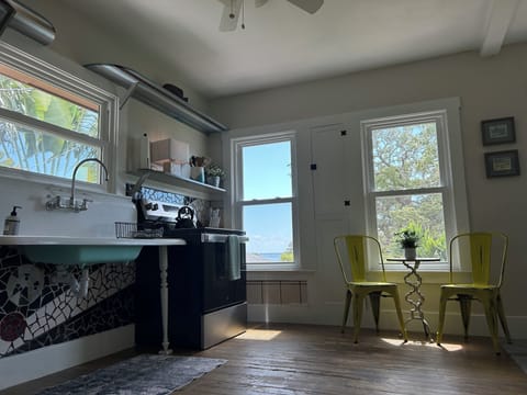 Water views from the vintage kitchen with updated appliances.