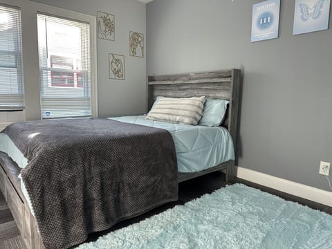 Plush queen bed, 55” Smart TV, cozy vibe, soft lighting—your perfect private room retreat!