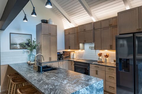 Our fully stocked kitchen features high-end appliances and ample cooking space—perfect for preparing delicious meals and enjoying quality time together. 