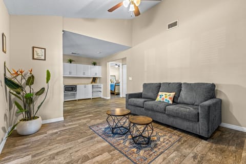 Just minutes away from the plush sofa, you’ll find the fully stocked kitchen — and right in front, easy access to the backyard for seamless indoor-outdoor living.