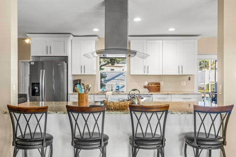 Gather ‘round the large island — where great meals and even better conversations happen. Fully stocked and ready for your culinary adventures!