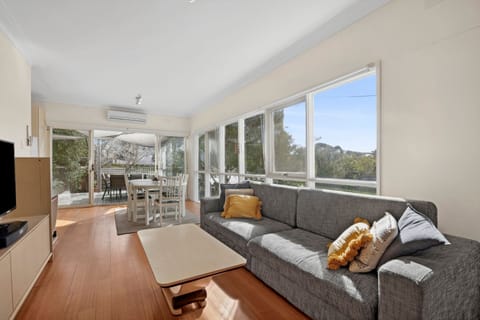 Light-filled living room with TV and ample seating