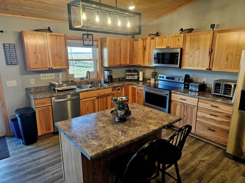 full kitchen with new appliances. the cupboards are well stocked for you