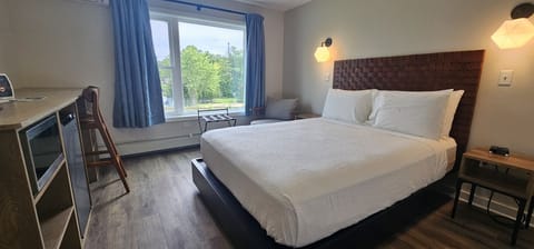 Comfortable queen bed with crisp linens for a restful night