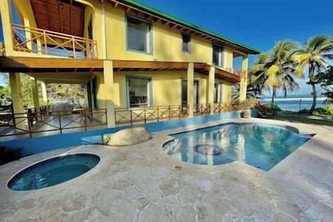 Windancer Beach House overlooking pool & hot tub.  Views of the ocean.