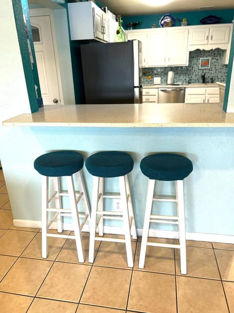 Large open kitchen with ample seating and breakfast bar