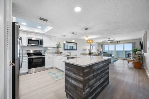 Large open kitchen with new stainless appliances