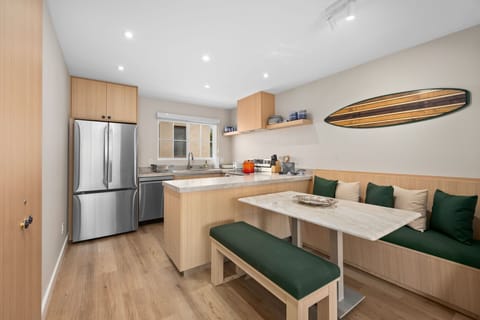 Seamless Dining-Living Flow
Open-concept layout connects the kitchen, dining, and living areas for easy vacation living.