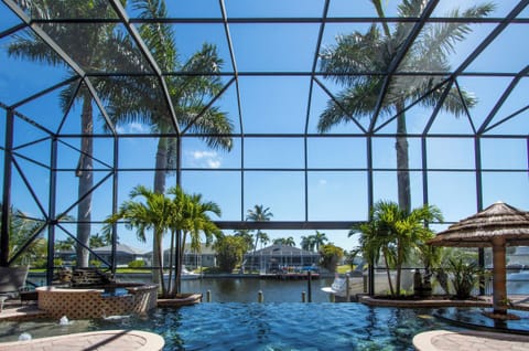 This luxury infinity edge pool offers postcard-worthy canal views right from the water's edge