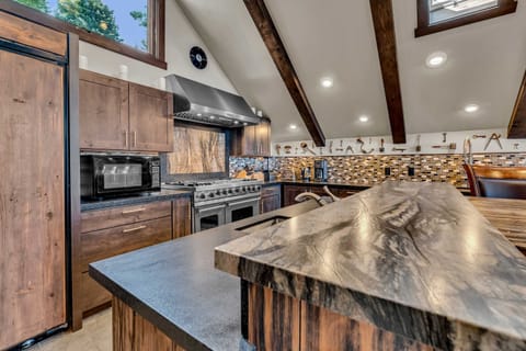 Kitchen: Second floor, drip coffee maker & keurig, toaster, waffle maker, Crockpot, cooking utensils, tableware
