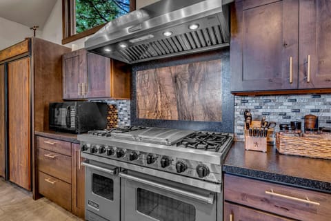 Kitchen: Second floor, drip coffee maker & keurig, toaster, waffle maker, Crockpot, cooking utensils, tableware
