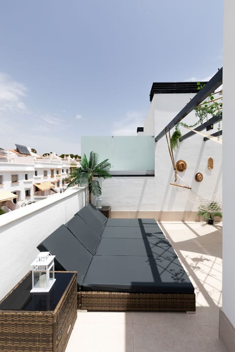Soak up the Spanish sun from the comfort of your private rooftop sunbeds—relaxation with a view.