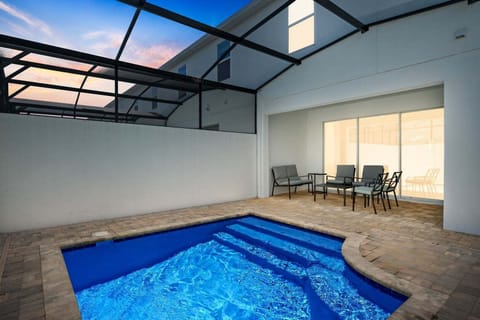 Unwind by the private pool at night in your cozy outdoor living room.