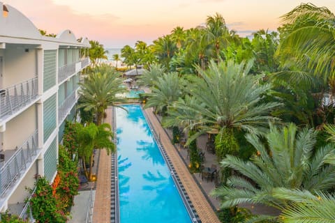 Unwind at sunset as the pool glows with calm.