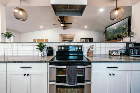 Don't miss out on the family and friends' adventures while in the kitchen. You will love the open kitchen/living concept.