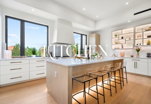 Start your day in a space filled with light, calm, and class. The kitchen is as gorgeous as it is functional.