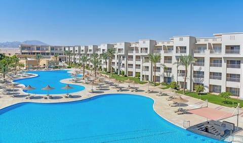 Dive into a sweeping lagoon pool framed by sun loungers.