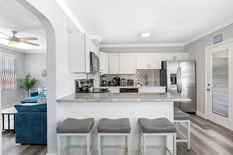 Modern kitchen & living area with open concept flow.
