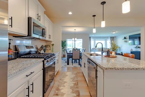 This stylish runner brings a cozy touch underfoot while complementing the kitchen’s clean, modern lines