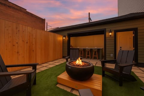 Unwind under the stars by the fire pit, steps from your private hot tub.