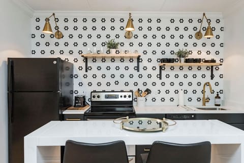 Unit 1 - Fully-stocked, updated kitchen with all cooking essentials, seating for 2 at the counter and separate room with a coffee bar.