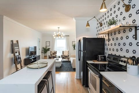 Unit 1 - Fully-stocked, updated kitchen with all cooking essentials, seating for 2 at the counter and separate room with a coffee bar.