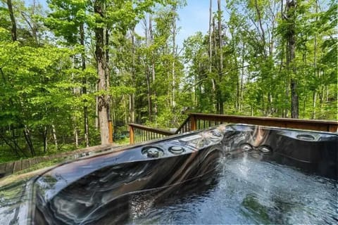 Hot tub located on the lower deck in the backyard