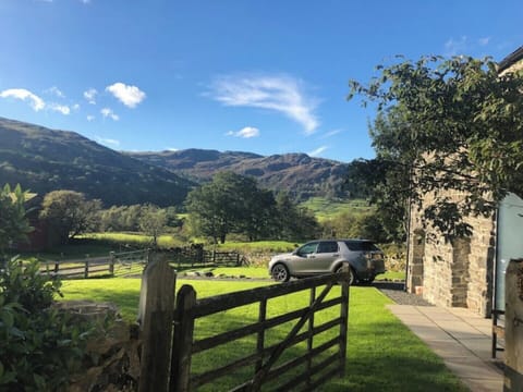 Front of the house, part of front garden and driveway, Kentmere views beyond.