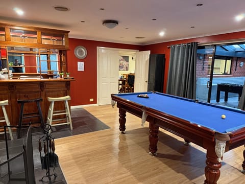 Enjoy our stylish Games Room with a premium 4x8 slate billiard table, foosball, air hockey, cozy fireplace (wood provided for one night only), quick electric heating, and a dry bar for drinks. Perfect for family fun and hotel-style relaxation.
