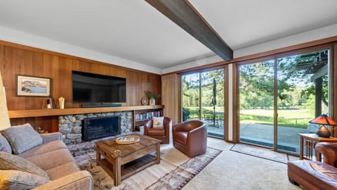 Enjoy sweeping views of Graeagle Meadows Golf Course from the living room