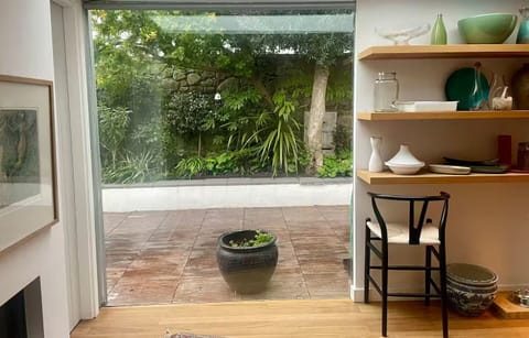 GROUND FLOOR. View from Kitchen looking out onto Split level Back Garden. 