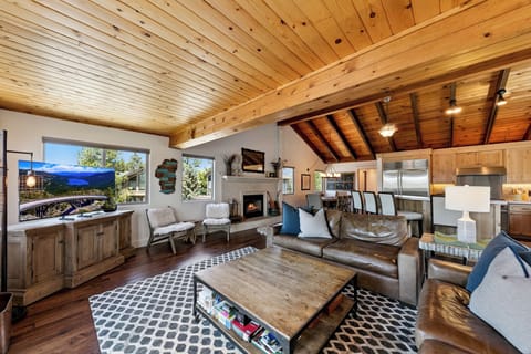 Plush couches and a roomy coffee table set the scene for cozy family game nights and unforgettable Tahoe memories.