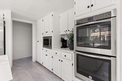 Kitchen: Sleek cabinetry and modern appliances await your culinary creations!