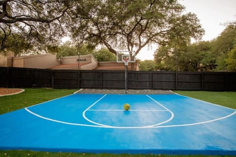Basketball Court: Shoot some hoops in your private paradise surrounded by lush greenery!