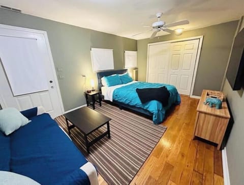 First-floor living room with 1 queen bed.