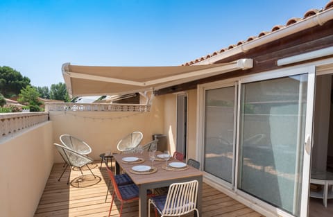 Large terrace with garden furniture, awning and barbecue