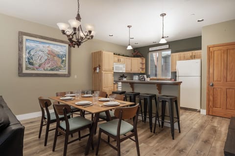 Gather around your spacious dining table for memorable meals, with a fully equipped kitchen and breakfast bar perfect for morning coffee chats.