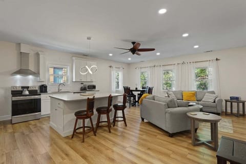 Experience effortless flow in this open-concept space where the living room, dining area, and kitchen come together for easy living and entertaining.