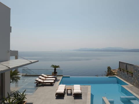 Perched above Palaiokastro’s shores, where luxury meets the lull of the sea.