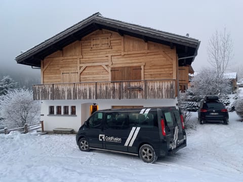 Front of chalet and parking