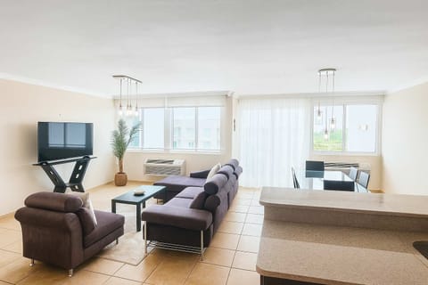 Bright and spacious living area with natural light, stylish furniture, and a cozy atmosphere — perfect for relaxing or gathering with friends.