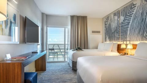 Step onto the balcony and breathe in salty ocean air.